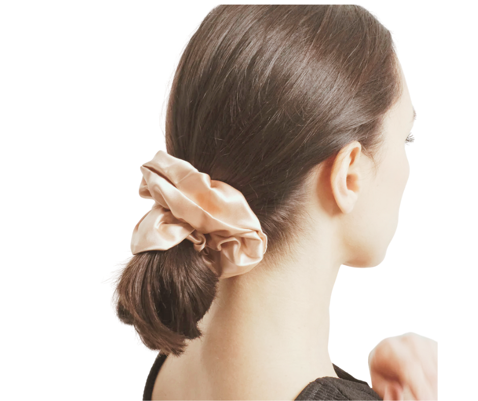 prosecco colored silk scrunchie on model with white background