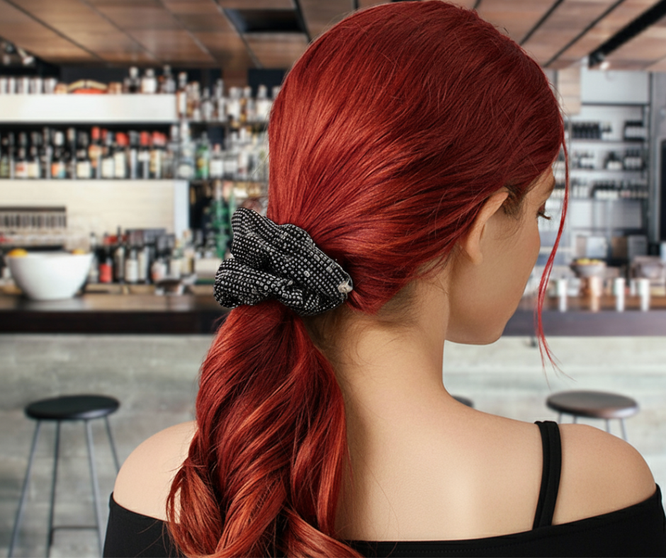 Hot pink satin bag with rhinestone scrunchie and gift card.