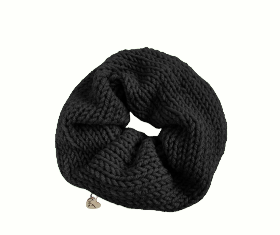 Black knitted scrunchie on a white background