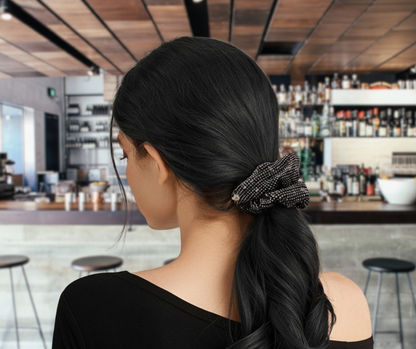 Grey rhinestone scrunchie on black-haired-model in restaurant.