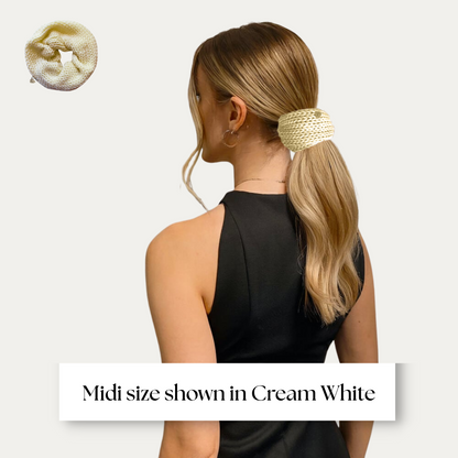 midi size scrunchie shown on model in black dress on light grey background.