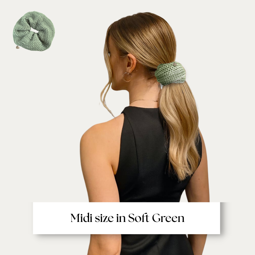 Midi size scrunchie shown on model in black dress on light grey background.