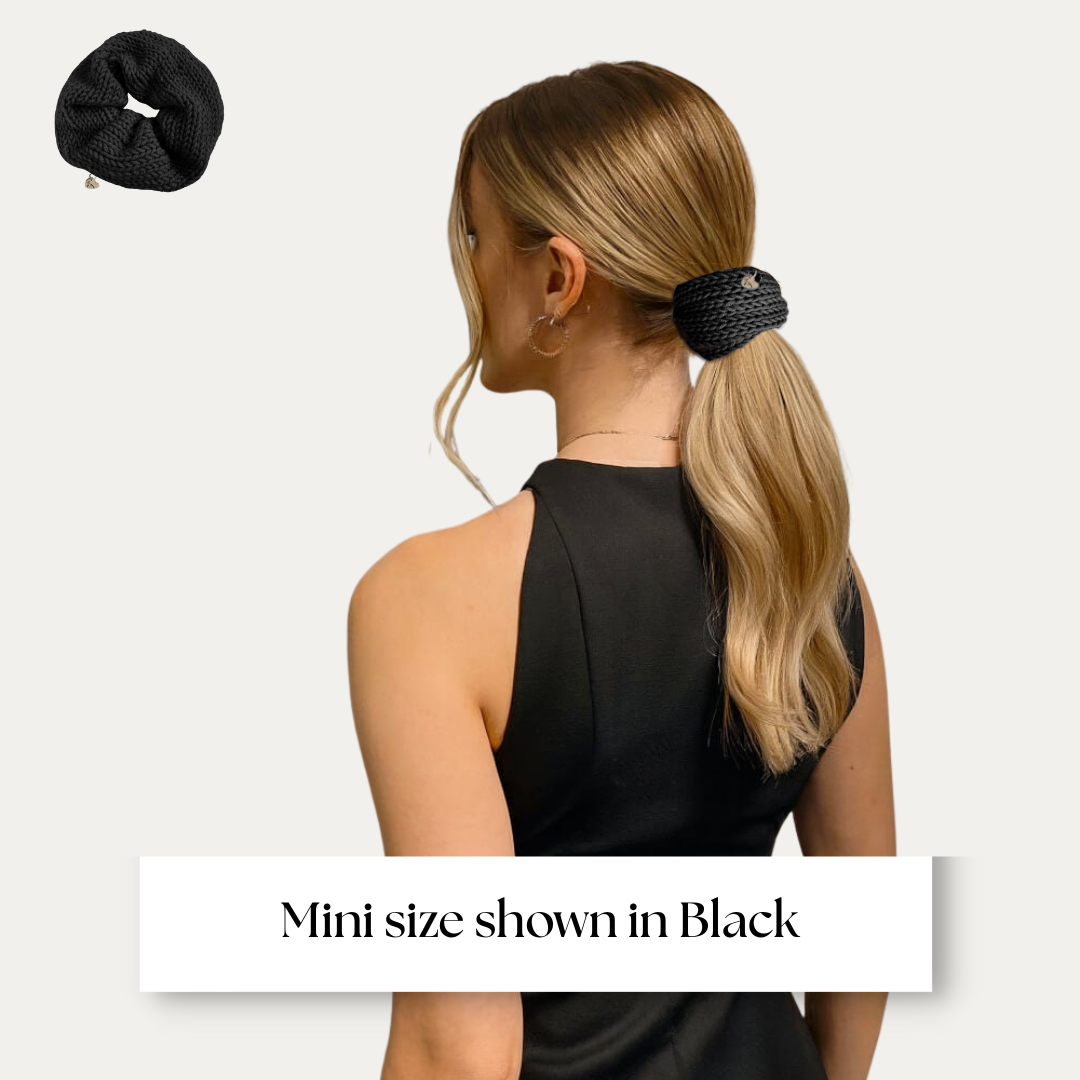 mini size scrunchie shown on model in black dress on light grey background.