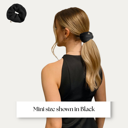 mini size scrunchie shown on model in black dress on light grey background.