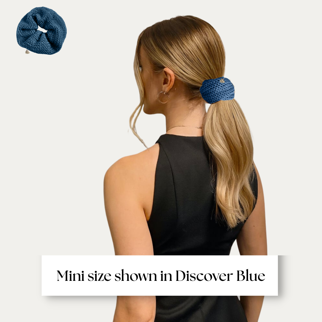mini size scrunchie shown on model in black dress on light grey background.