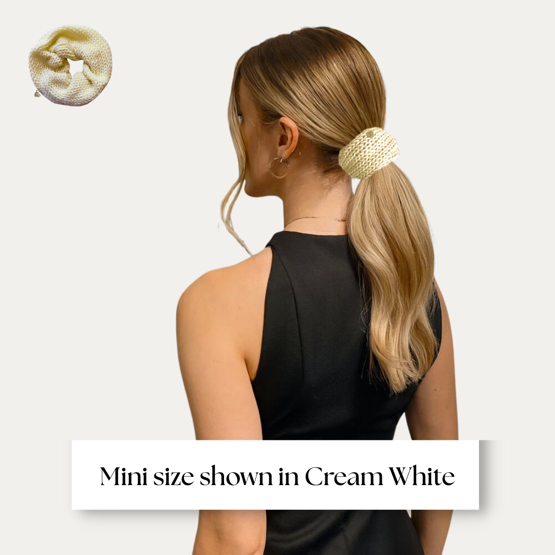 mini size scrunchie shown on model in black dress on light grey background.