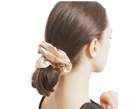 prosecco colored silk scrunchie on model with white background