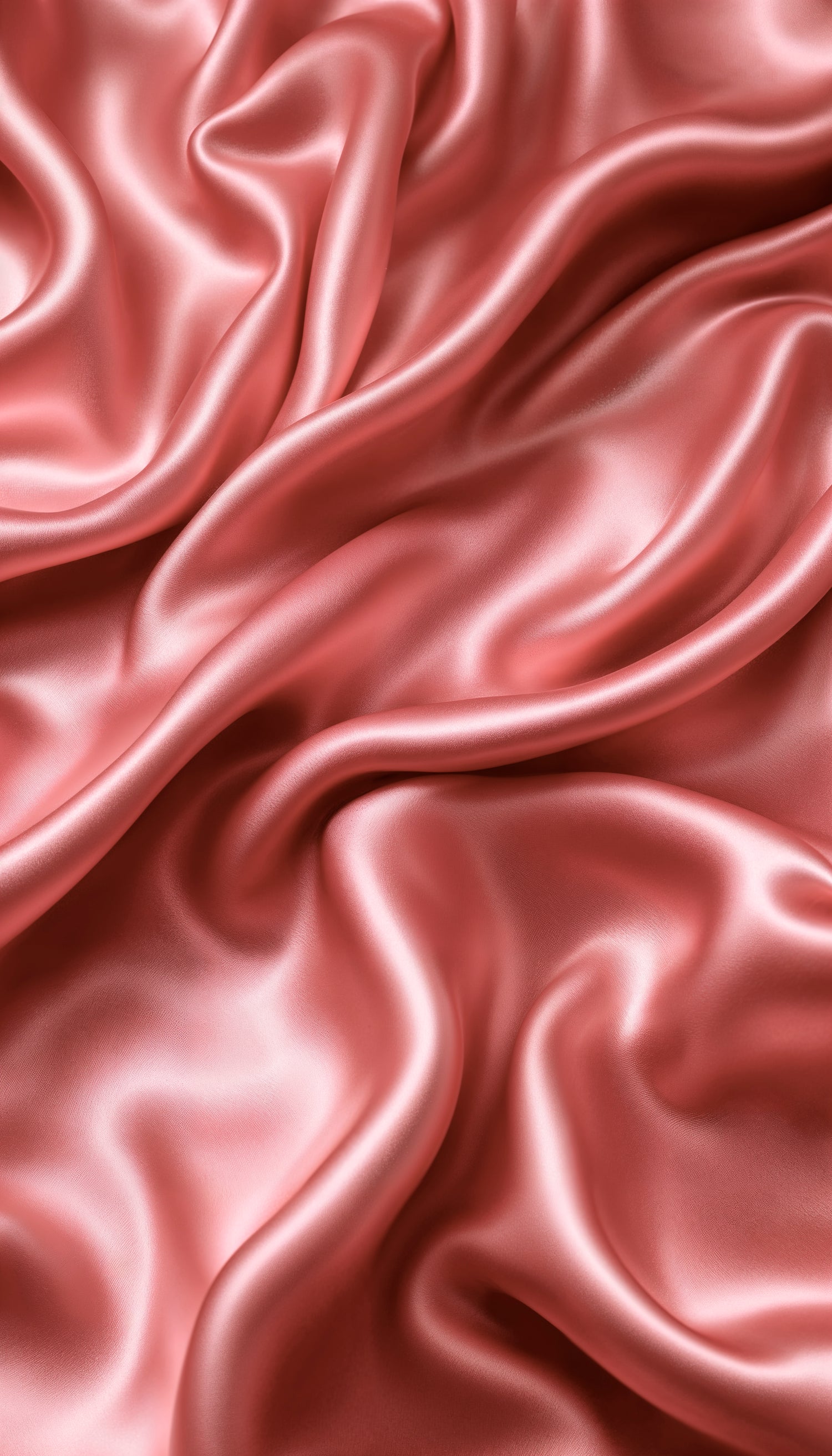 Close-up of rose gold silk fabric with folds