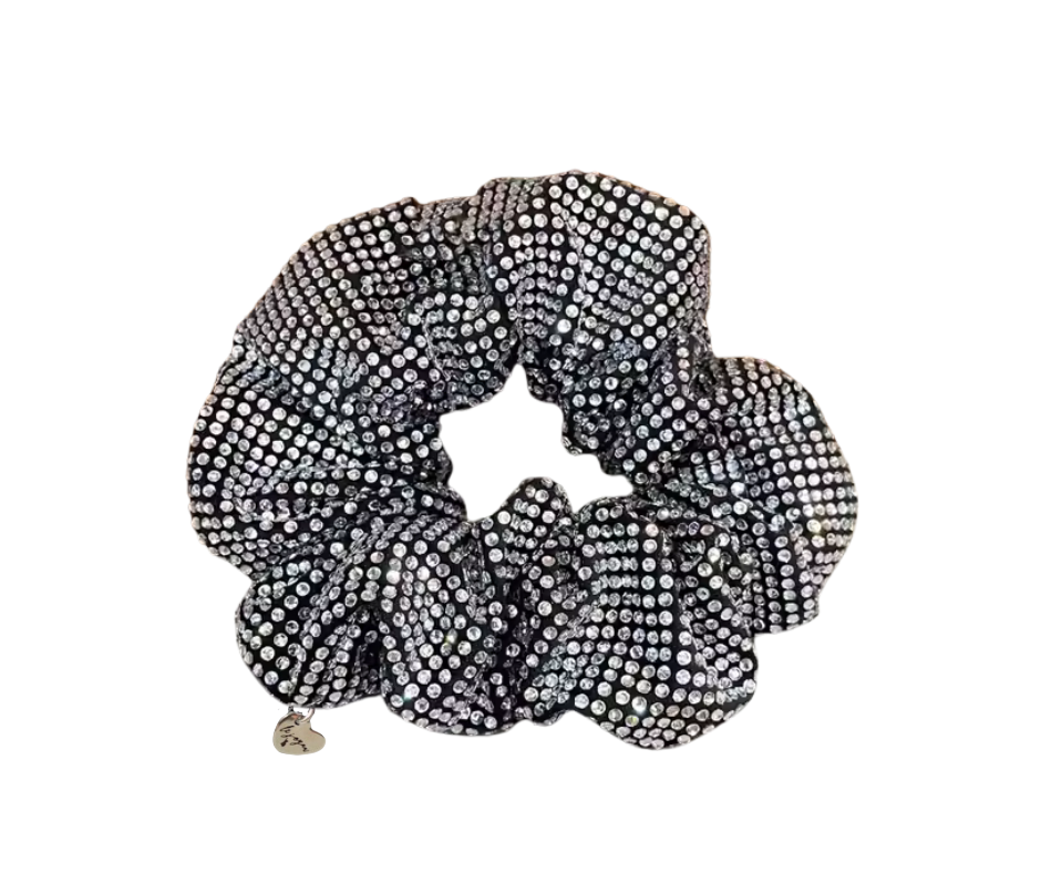 Black scrunchie with silver rhinestones and small heart charm, on a white background